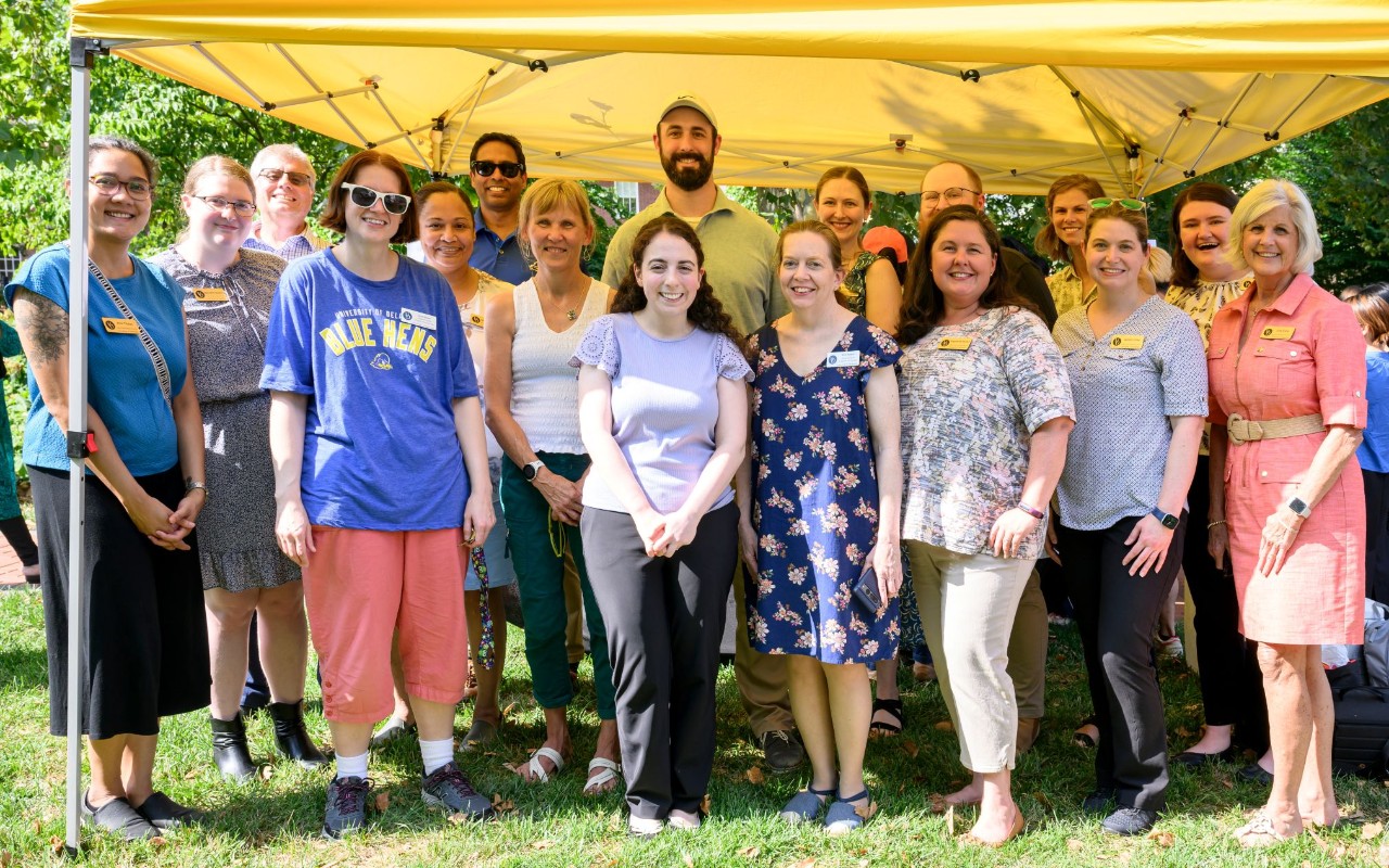 A photo of CGPS staff with President Carlson outside of Elliott Hall