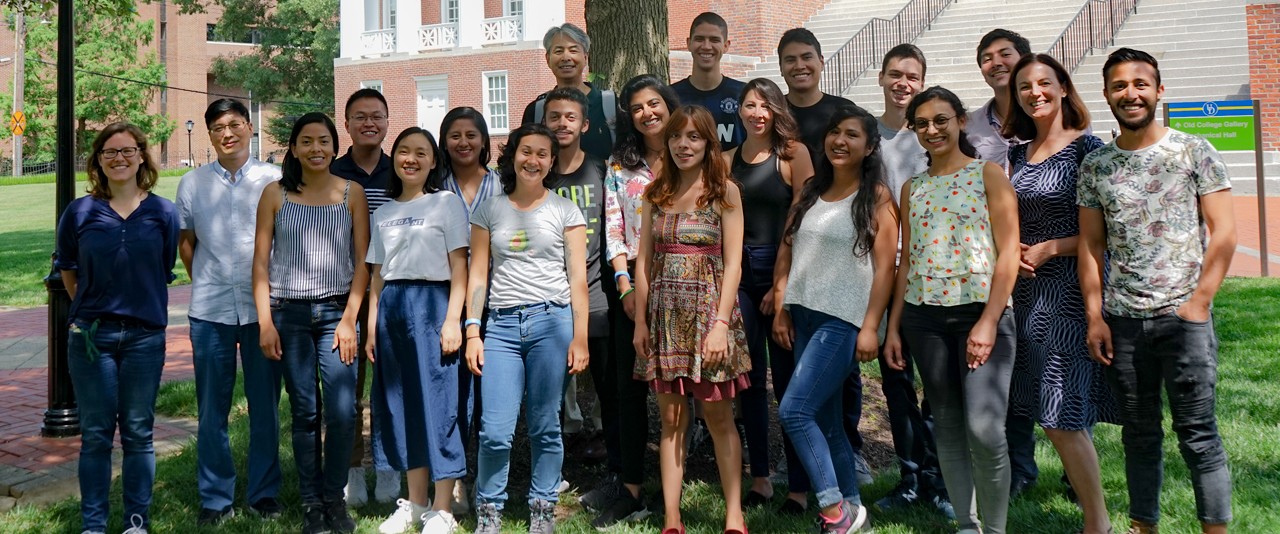 Cohort of scholars gathered on Old College lawn