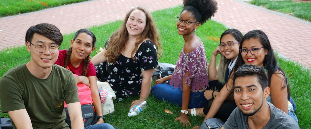 International Students in Front of Old College International students gather on Old College lawn