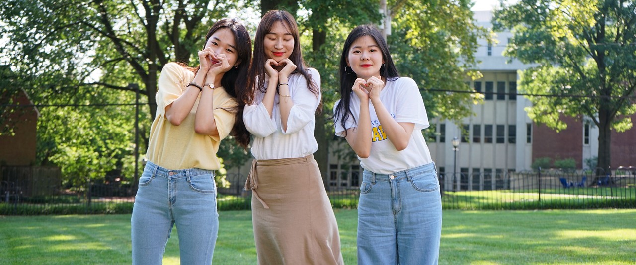 New international students gather on the Old College lawn, expressing fondness for UD and each other