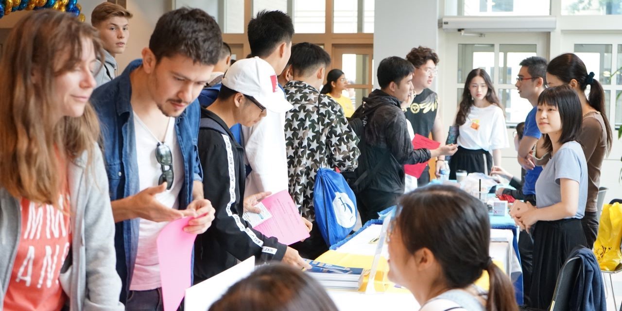 Staff show their fun side at the conclusion of international student orientation