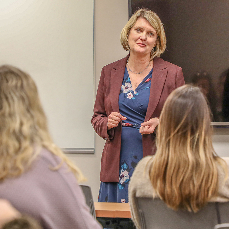 Patricia Scroggs speaks to a classroom of students