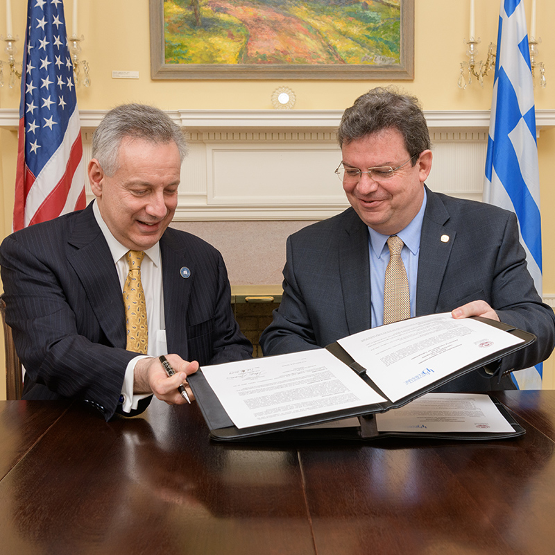 President Dennis Assanis exchanges agreements with the President of Aristotle University.