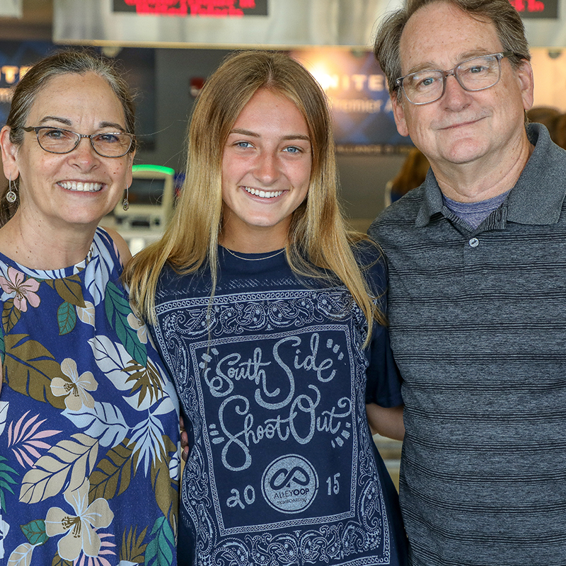 A World Scholars family poses for a photo at the airport.