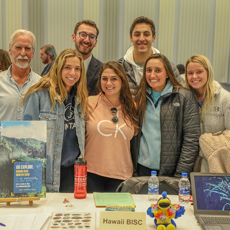 UD students volunteer with their faculty director at the Study Abroad & Global Studies Fair.