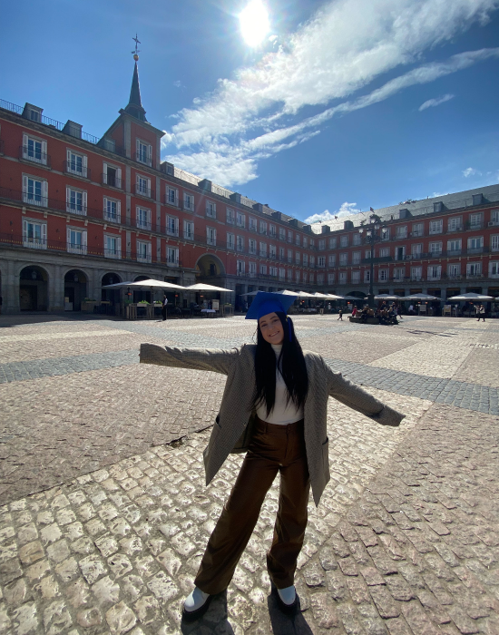 woman in front of European building
