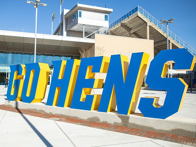 A photograph of the "Go Hens" sign that sites outside the Whitney Athletic Center.