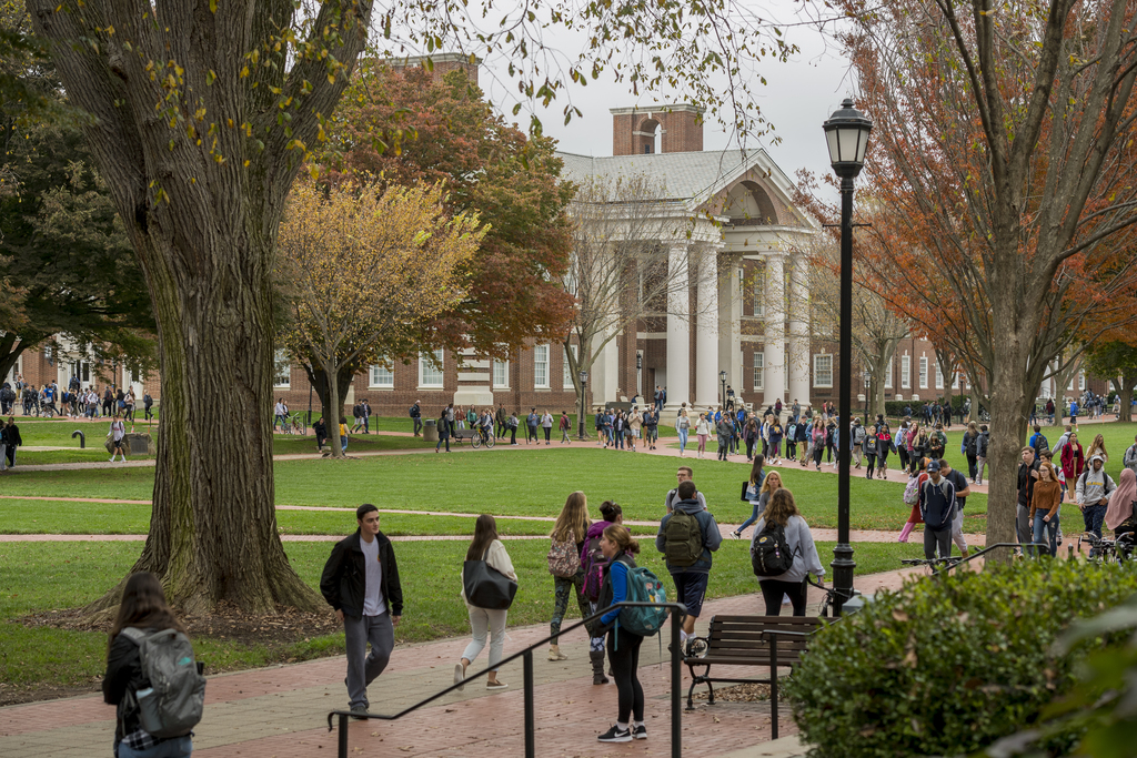 A scene from the University of Delaware's campus with students crossing the north Green.