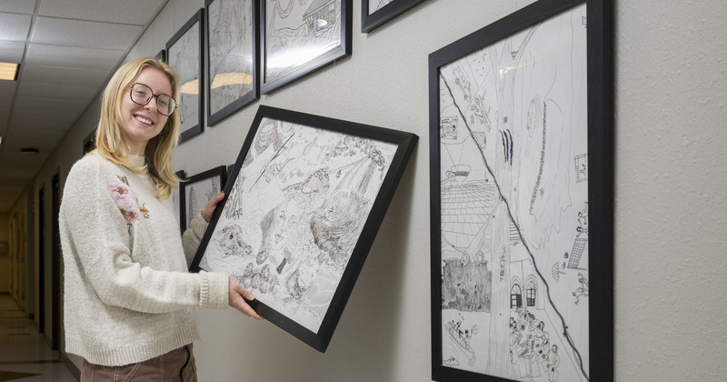 “Art has always been an outlet to help figure out who I am, what I like to do, and how I see other people,” said Morgan Oliver, whose drawing of her study abroad experience in the Amazon now hangs in Townsend Hall.
