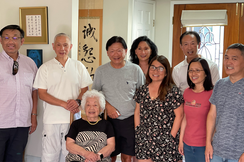 Olive Hong, seated, is pictured here with her family, including fellow Blue Hens: nephew Raymond Chin (back row, far right), nephew Gordon Chin (back row, center), and niece Diana Chin Wienszczak (back row, second from right).