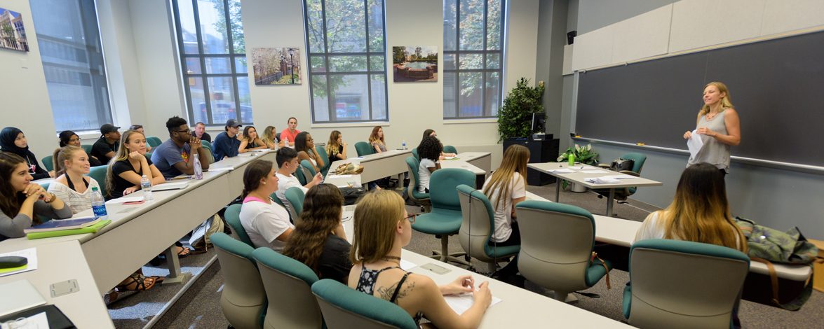 CAS-AA-Classes_at_UDDC-083116 A group of students in a seminar on campus.