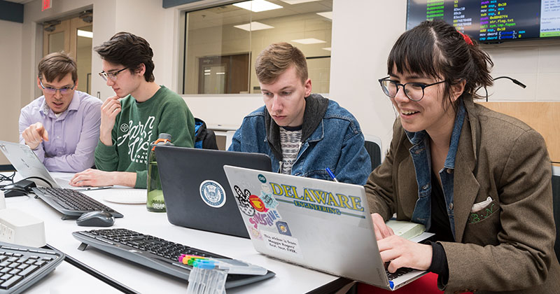 Prof. Novocin and students in the cybersecurity computer lab