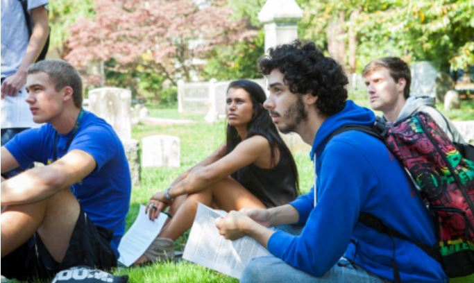 Student having class on the green.