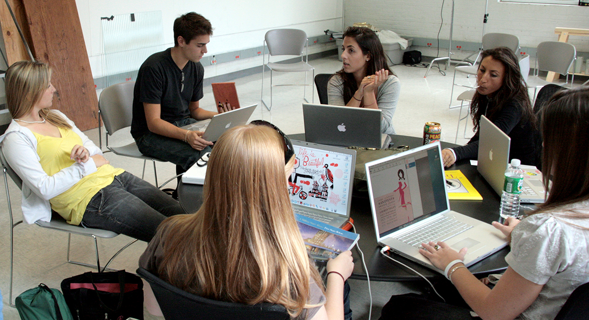 art-students-visual-design Visual communications students work together in class.