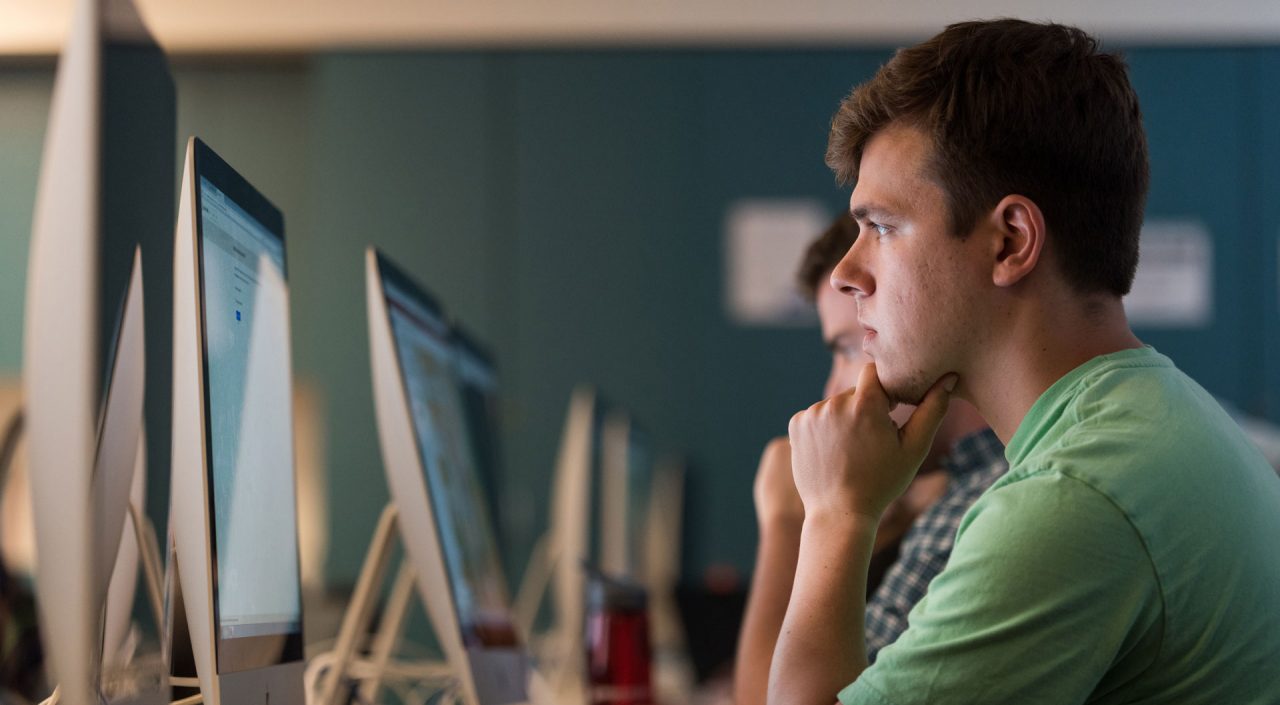 male student on computer