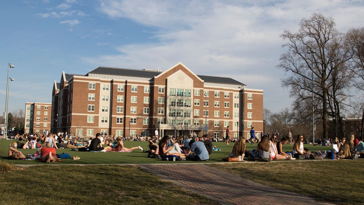 university of delaware honors students posing in front of a backdrop