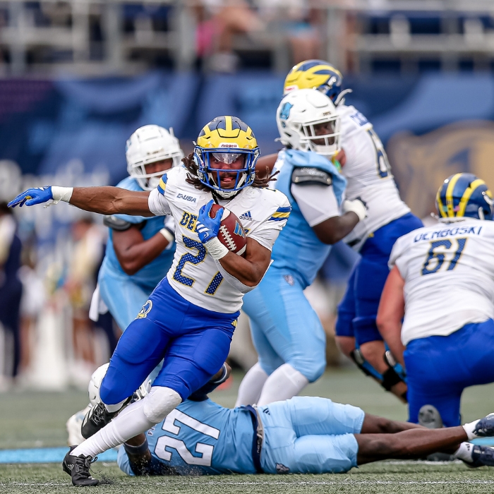 A UD football player on the field.