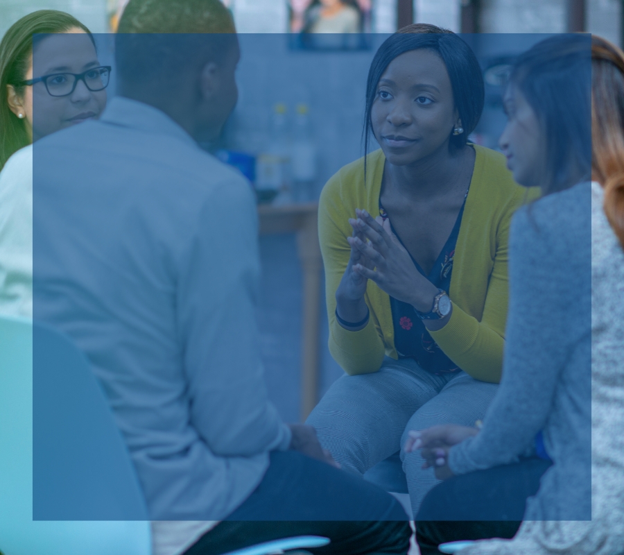 A group of young adults at a mental wellness meeting