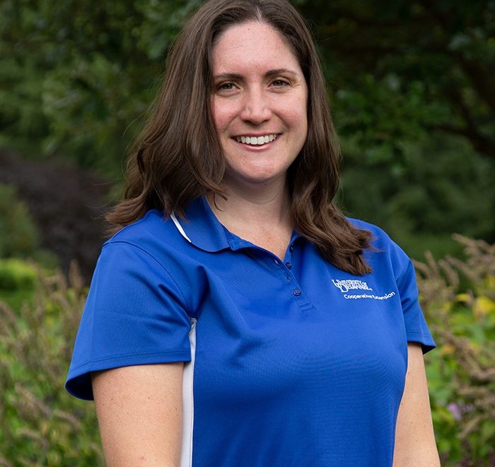 Photo of Jennifer Volk in the field Cooperative Extension