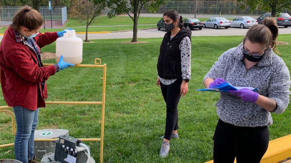 The CEWER team testing wastewater in the field.