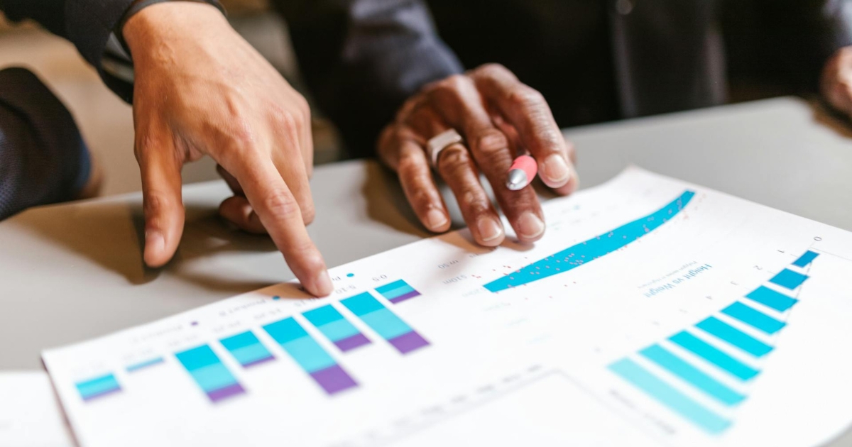 Two people reviewing statistical work.