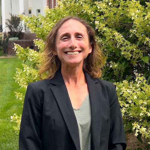 A headshot of Sandy Raimondo.