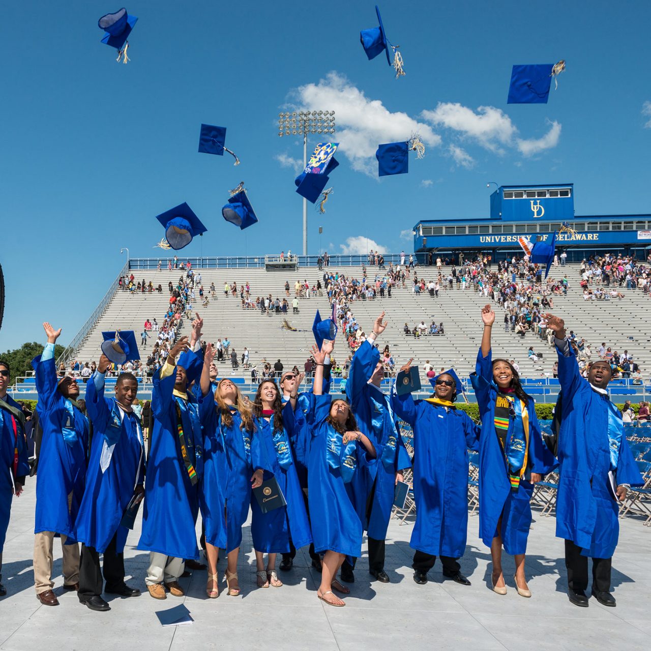 Graduates excited throwing caps