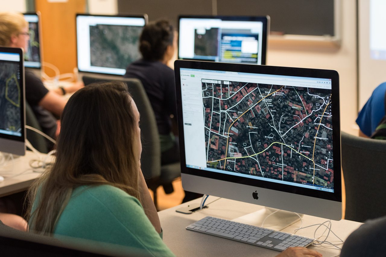 Student at computer looking at map on screen