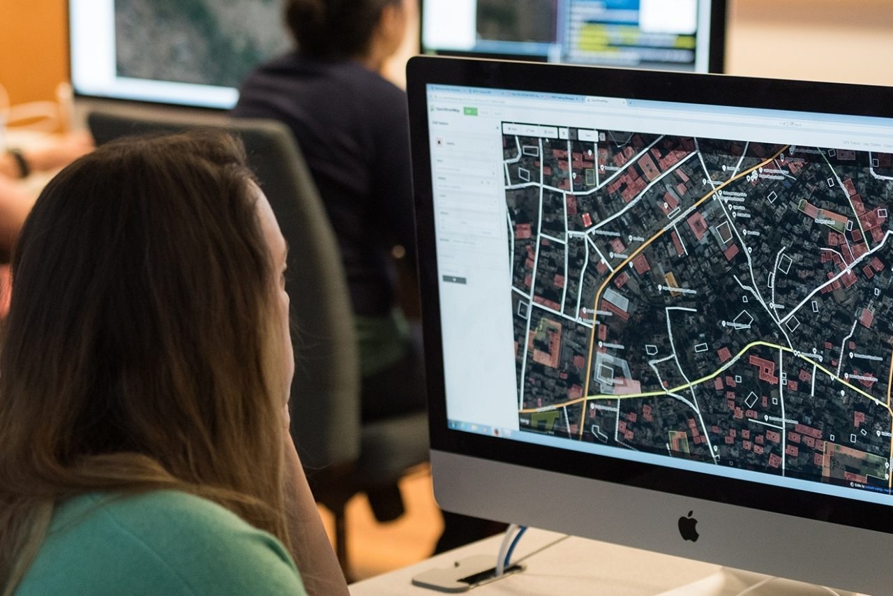 Student at computer looking at map on screen