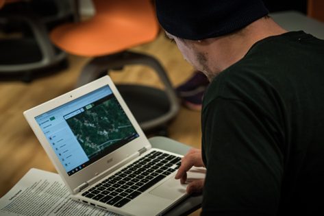 Student using mapping software on laptop