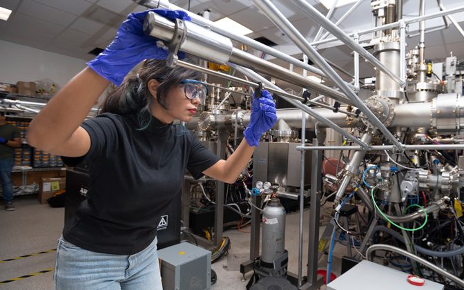In the University of Delaware Materials Growth Facility, doctoral student Nazifa Tasnim Arony uses a method called molecular beam epitaxy to deposit atoms of various elements, layer by layer, to build a new material for potential use in quantum computers. She and her collaborators will then test the material's optical properties.