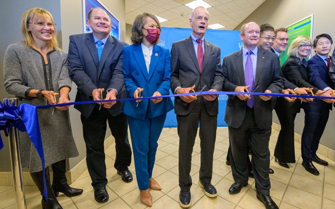 Ribbon-cutting ceremony Oct. 19 in Delaware Technology Park. Attending, from left, are UD Provost Laura Carlson, Ron Schoon, executive manager, partnership development at the U.S. Department of Energy’s National Renewable Energy Laboratory (NREL), U.S. Rep. Lisa Blunt Rochester, U.S. Sen. Tom Carper, U.S. Sen. Chris Coons, Yushan Yan, director of the Center for Clean Hydrogen, Mark Newman, president and CEO, Chemours, Denise Dignam, president APM, Chemours, Kelvin Lee, UD interim vice president for research, scholarship and innovation, and Levi Thompson, dean of the College of Engineering.