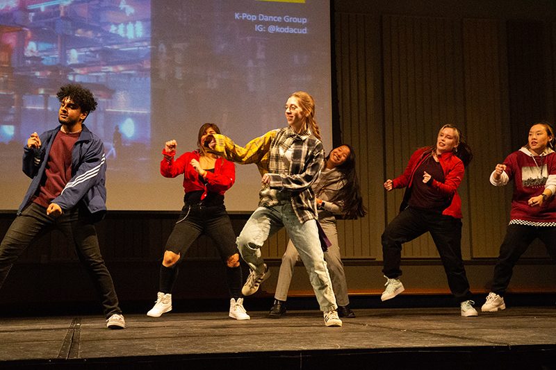 Students dancing on stage at an APSA Night Market event