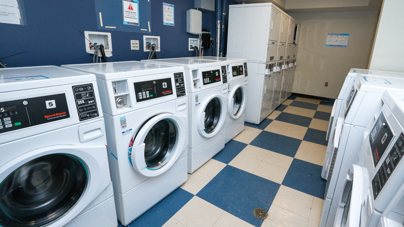 George Read laundry: a blue and white checkered floor with washers and dryers along the walls.