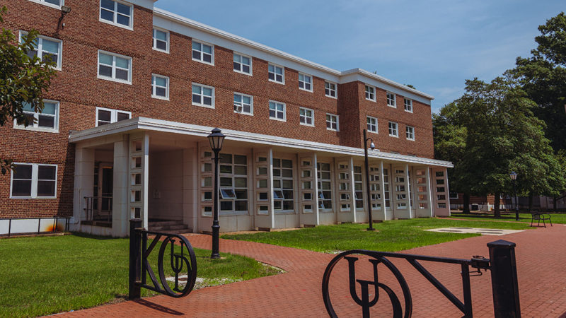 Black gates prevent cars from being able to drive down the brick walkway in front of Thompson Hall. 
