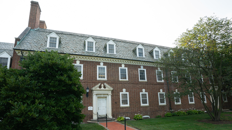 Brick walkway leads up to the main entrance of the New Castle Residence Hall.