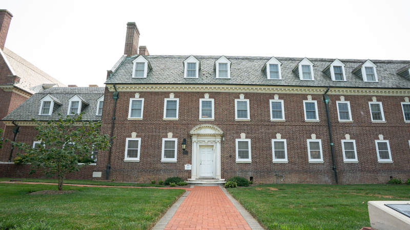 Brick walkway leads up to the main entrance of Sussex Residence Hall.