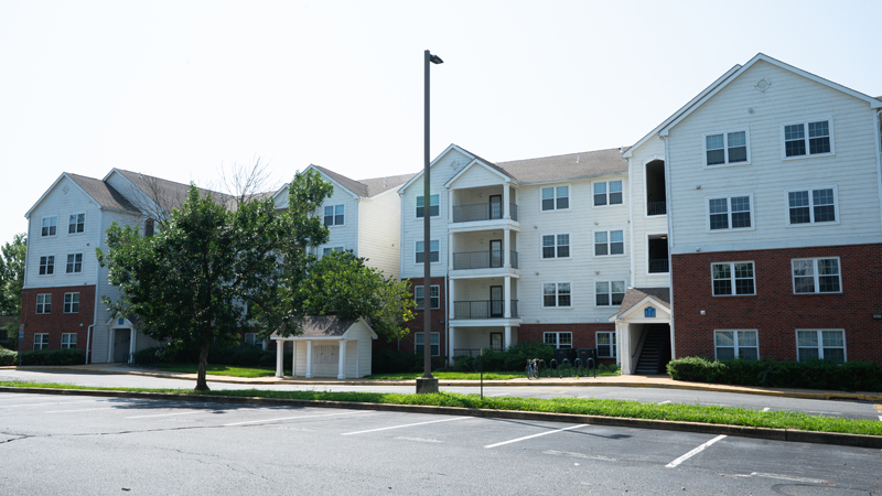 University Courtyard Apartments building 300 and part of the parking lot.