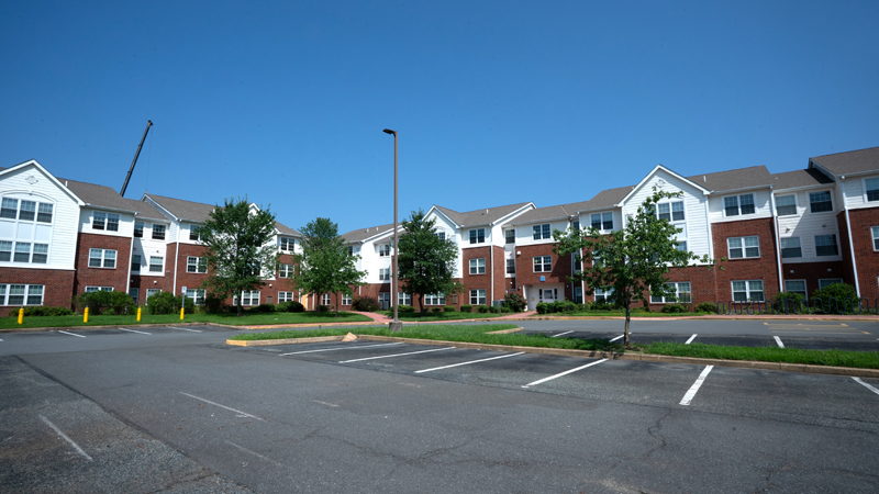 Corner of the University Courtyard Apartments buldings 700 and 800 and corner of the UCA parking lot.