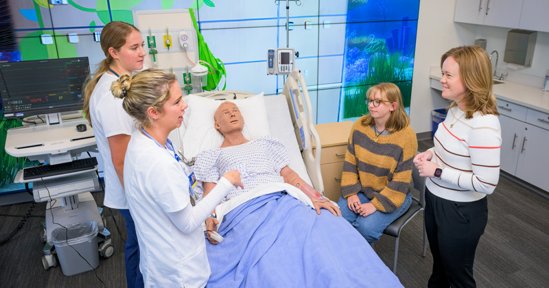 Lt. Gov. Kyle Evans Gay with health professionals and students at UD