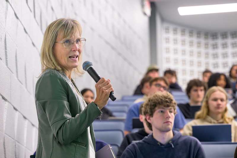 President Laura Carlson attending class with students