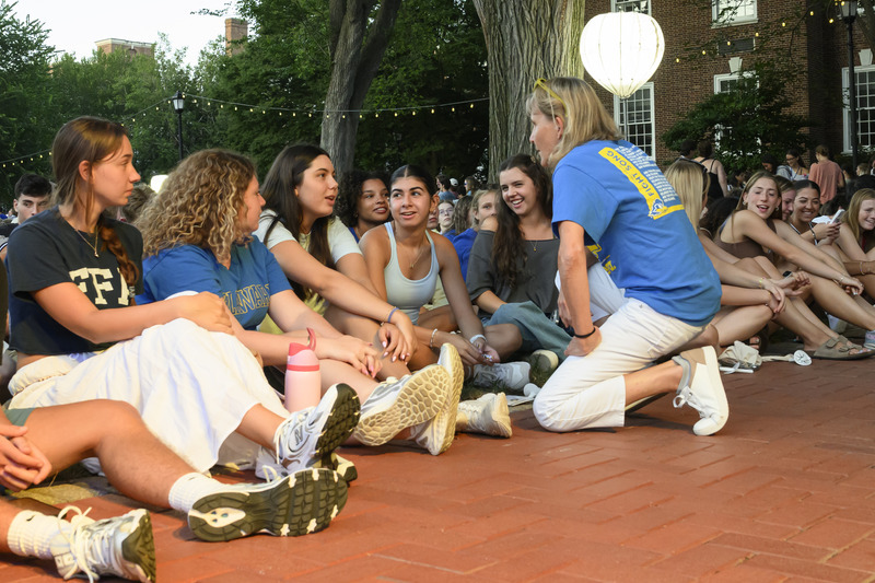 President Laura Carlson talking with first-year students