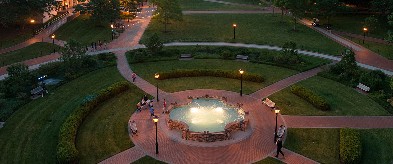 Aerial shot of the fountain on the Green at twilight. 
