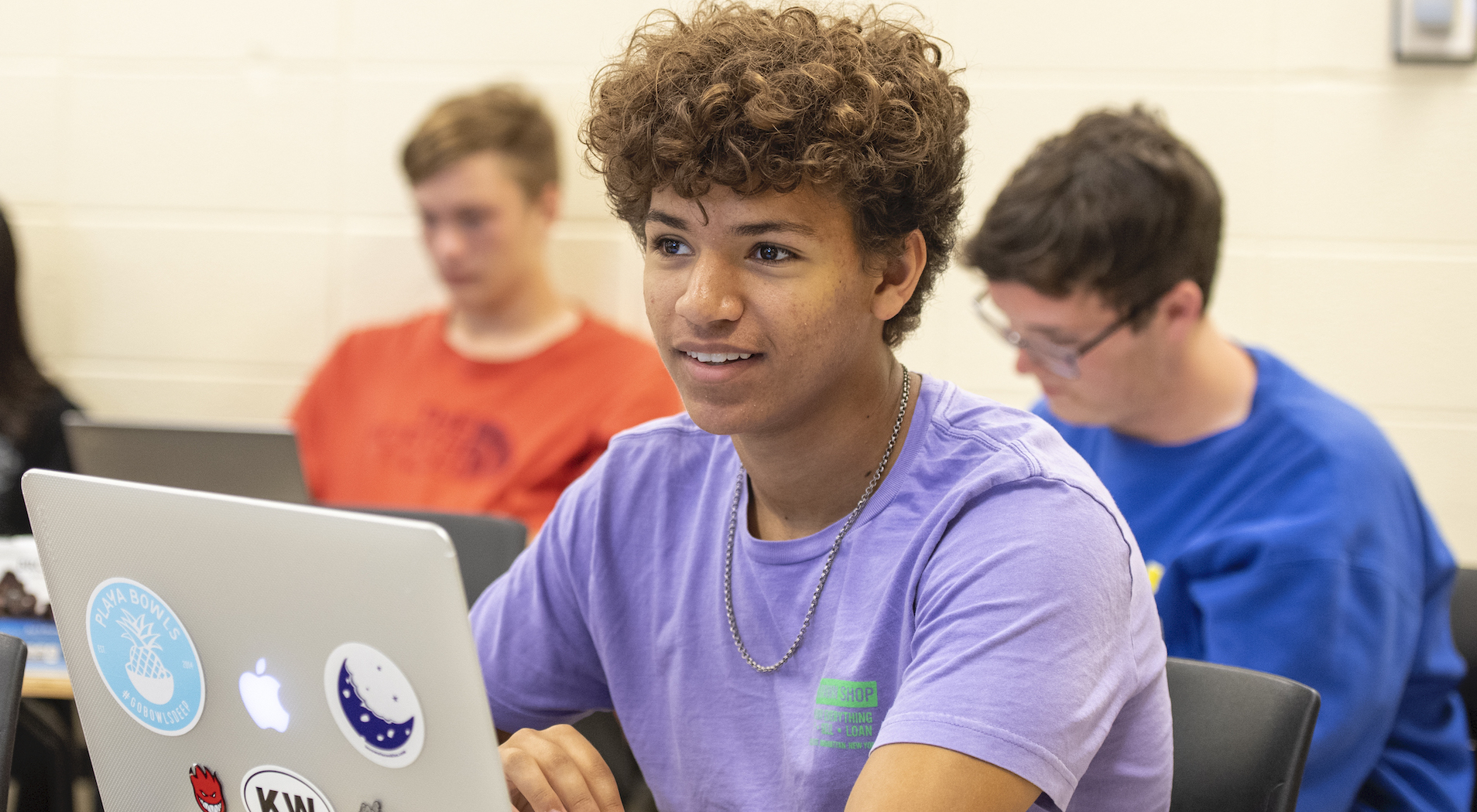 student sitting in classroom participating in UD edge program