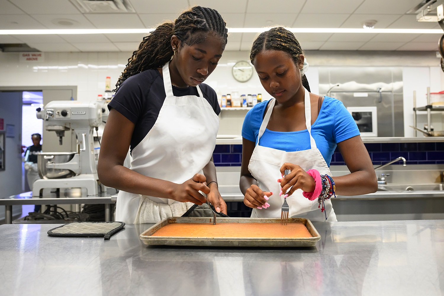 Edge students using UD's Vita Nova professional kitchen during class.