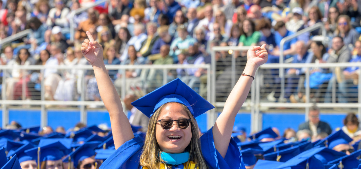 Biden School Undergraduate Programs Students wearing caps and gowns at graduation