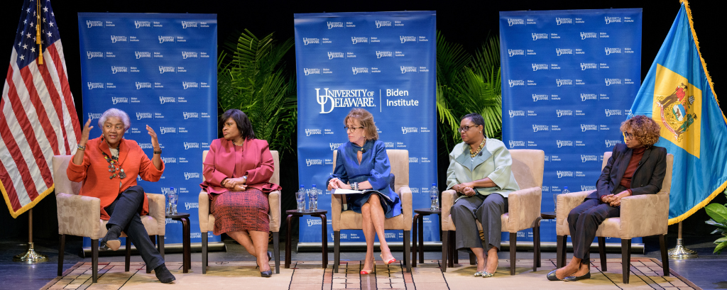 Photo of Donna Brazile, Yolanda Caraway, Leah Daughtry, Minyon Moore and Valerie Biden Owens sitting side-by-side onstage during the "For Colored Girls Who Have Considered Politics" book discussion event