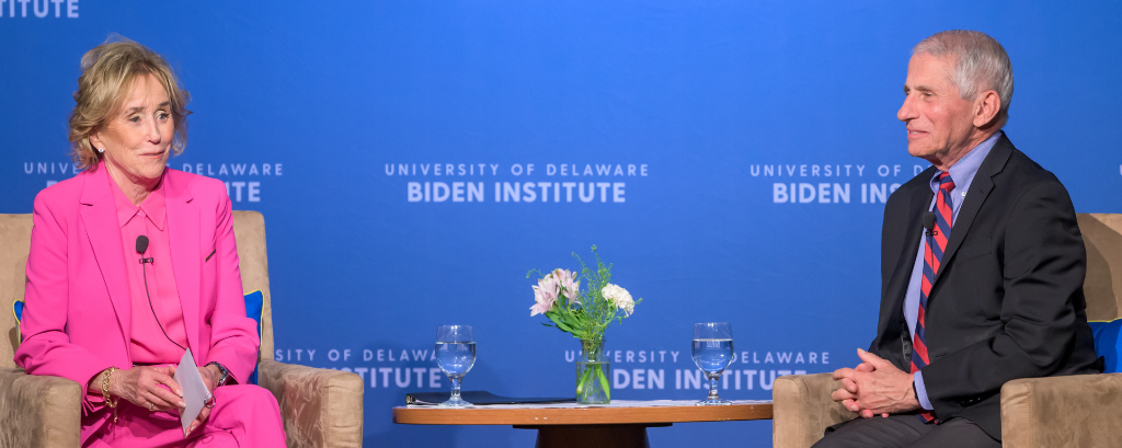 Photo of Biden Institute chair Valerie Biden Owens sitting across from Dr. Anthony Fauci onstage during a Fireside Chat event at the University of Delaware