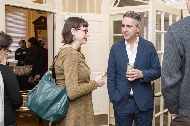 Senior Fellow John Della Volpe speaking with a woman