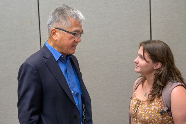 Senior Fellow Gary Locke speaking with a student